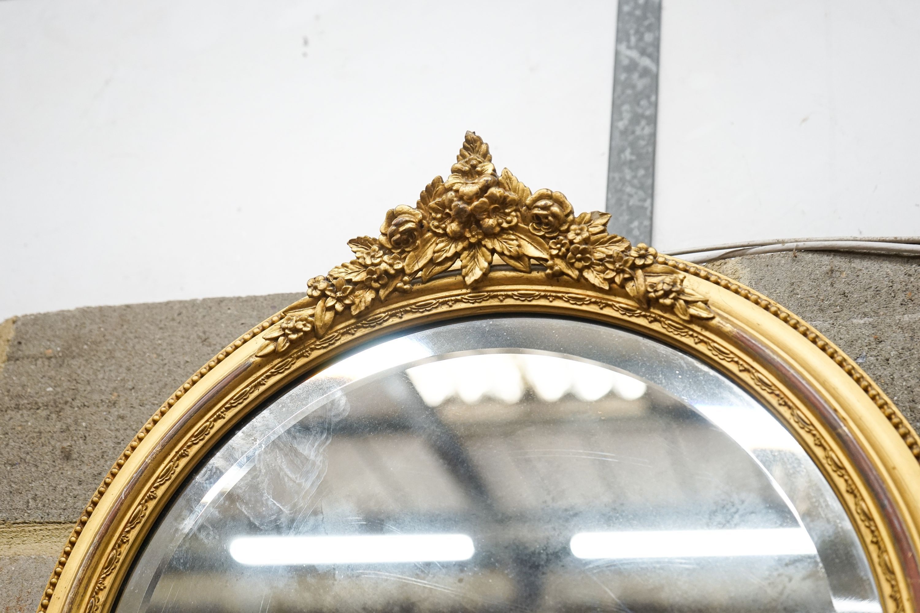A Victorian circular gilt gesso wall mirror, diameter 48cm